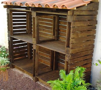 a wooden shelf sitting next to a building